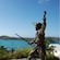 A statue of a pirate with his sword drawn, guarding a bay